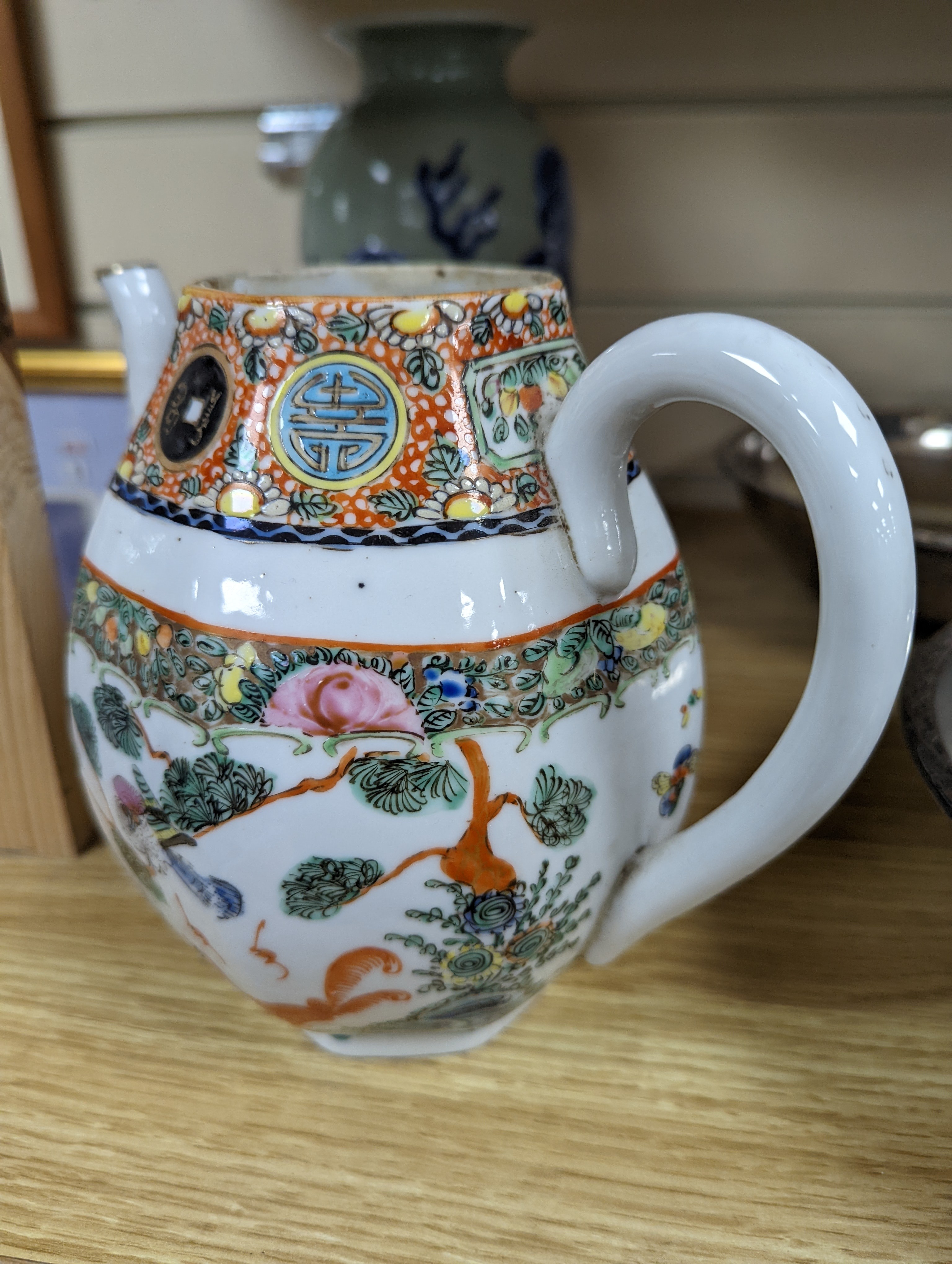 A Chinese celadon glazed vase, 24cm and a Chinese famille rose teapot and matching cream jug, a.f.